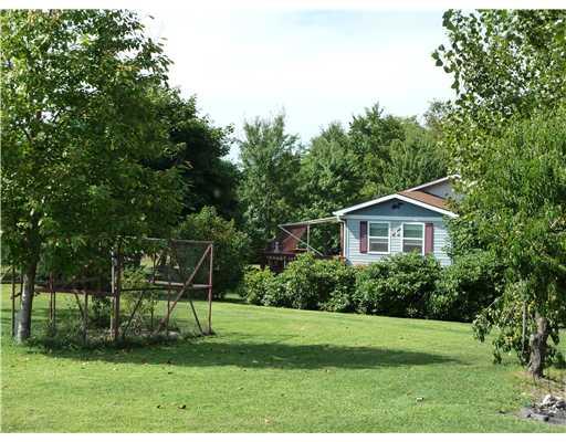 143 Whiteshill Road Rochester, PA 15074 - Photo 15 of 18 Exterior Back. Moving into the side yard you can see the deck area. Grounds are full of fruit trees/bushes, perennials, trees, beautiful landscaping, meticulously cared for! Room for gardens galore!
