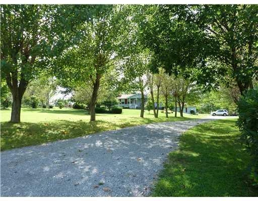 143 Whiteshill Road Rochester, PA 15074 - Photo 3 of 18 Exterior Front. Come home to your own private haven! Driveway, lined with beautiful Poplar trees creates a shady retreat! Large turn-around, parking and 2 car integral 24x24 foot drywalled garage!