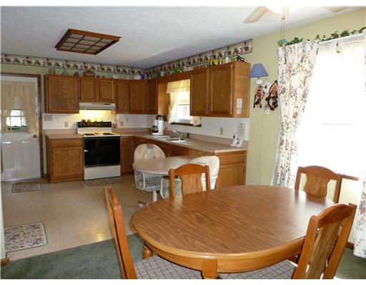 143 Whiteshill Road Rochester, PA 15074 - Photo 4 of 18 Kitchen. Open floor plan with adjoining dining area. Back door leads to closed-in 13x11 back porch and 12x12 deck with 10x10 awning. Room for entertaining and family get togethers!