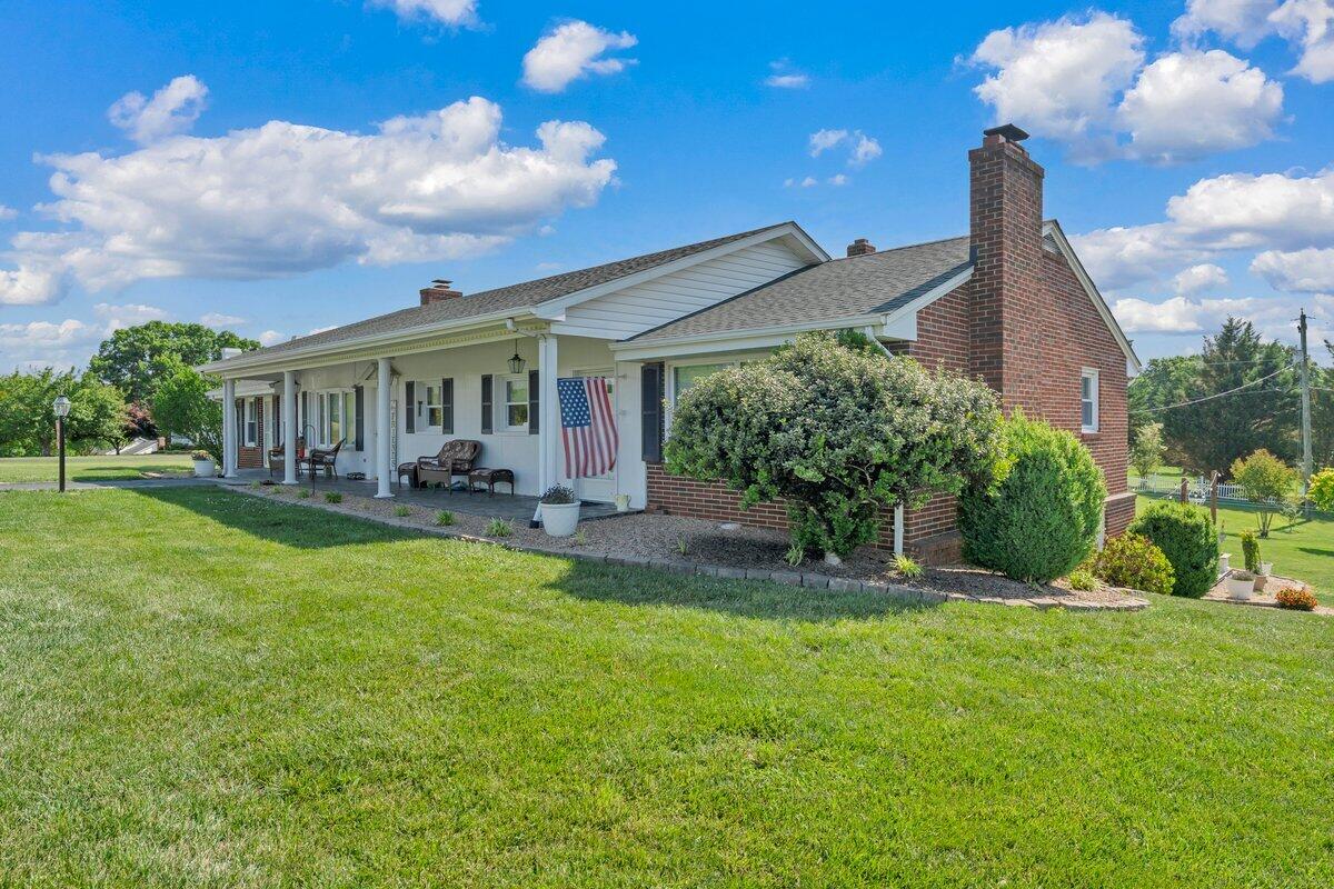 3226 Rakes Road Rocky Mount, VA 24151 - Photo 3 of 74 a view of house in front of a big yard with potted plants