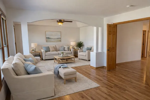 a spacious bedroom with a bed and a couch