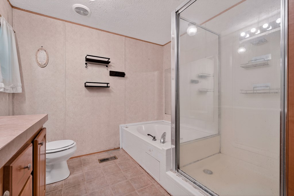 282 West Cherry Road Hayesville, NC 28904 - Photo 14 of 45 a bathroom with a toilet and a shower