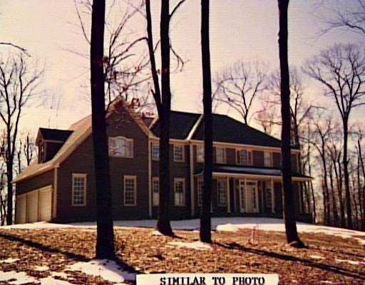 81 Horseshoe Ridge Road Newtown, CT 06482 - Photo 1 of 1 a view of a house with trees in the background