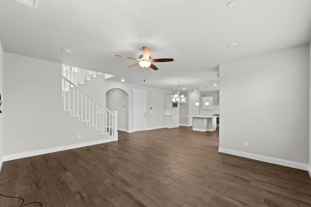 a view of an empty room with a ceiling fan