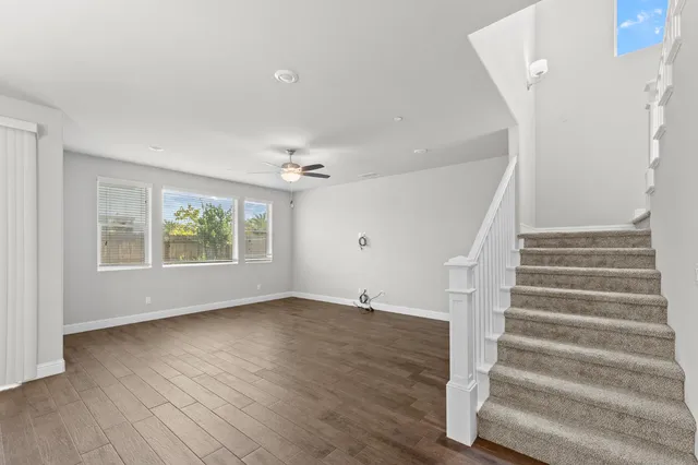 a view of entryway with wooden floor and front door