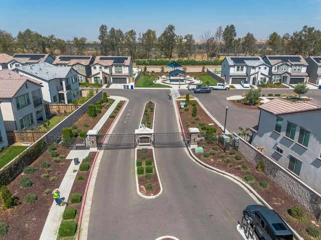 an aerial view of a house with a garden space