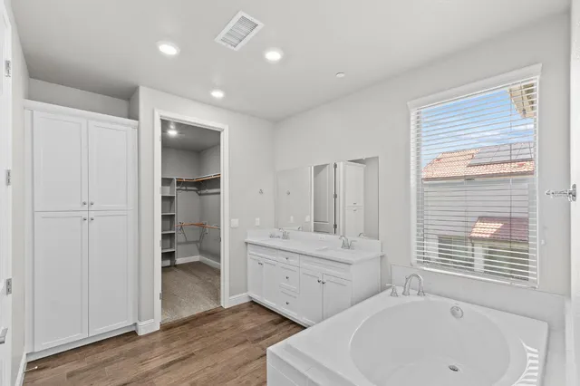 a bathroom with a bathtub and a sink
