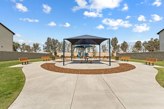 a view of a swimming pool with an outdoor seating