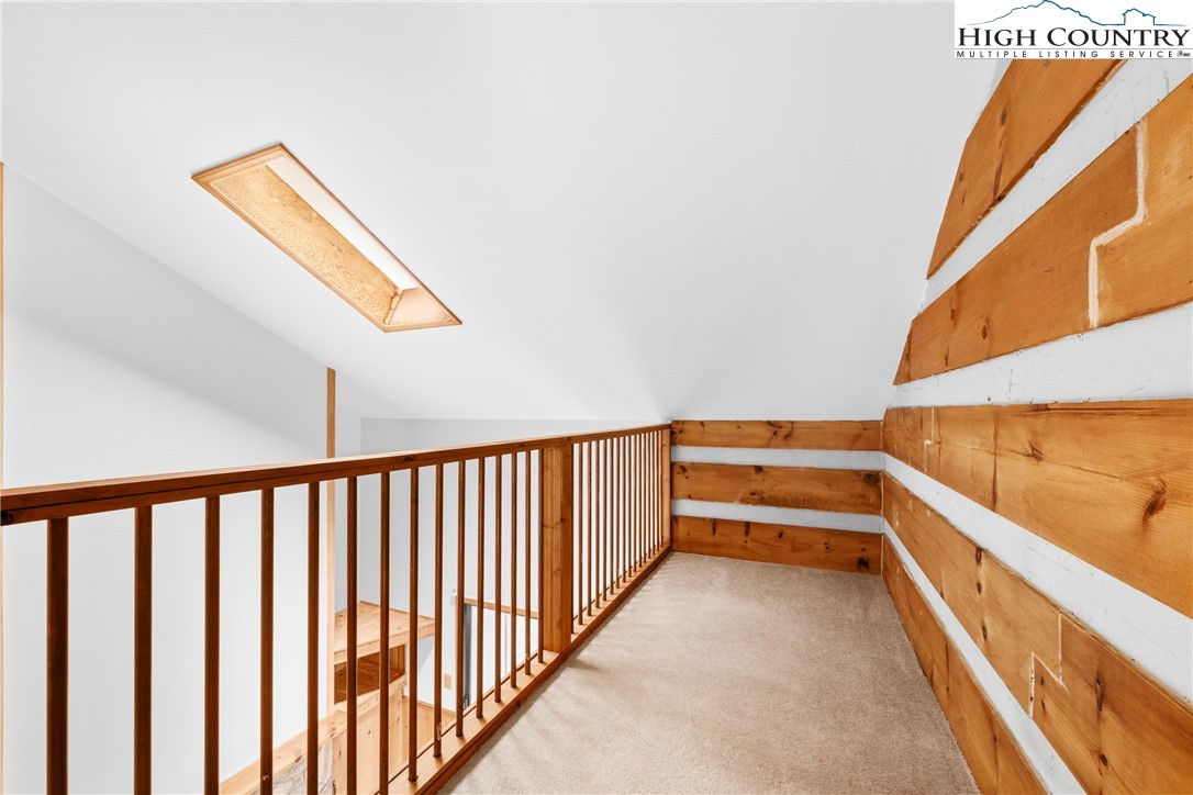 106 Sherry Lane, Unit 106 Boone, NC 28607 - Photo 13 of 27 a view of hallway with stairs and wooden floor