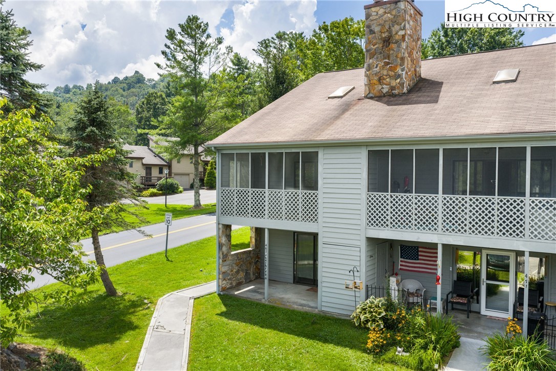 106 Sherry Lane, Unit 106 Boone, NC 28607 - Photo 20 of 27 a backyard of a house with seating space