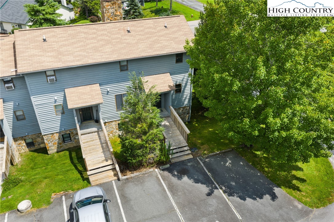 106 Sherry Lane, Unit 106 Boone, NC 28607 - Photo 23 of 27 a front view of a house with a yard