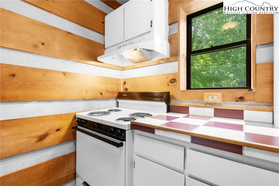 106 Sherry Lane, Unit 106 Boone, NC 28607 - Photo 7 of 27 a kitchen with a sink and a window