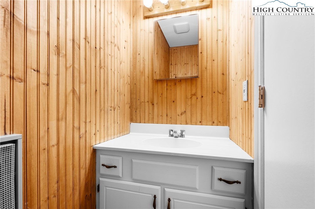 106 Sherry Lane, Unit 106 Boone, NC 28607 - Photo 9 of 27 a bathroom with a sink and a mirror