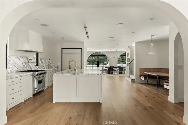 a kitchen with a sink and stove