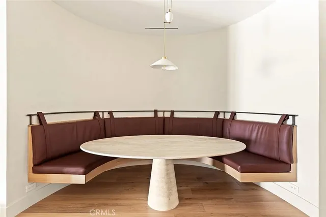 a view of a dining room with furniture and window