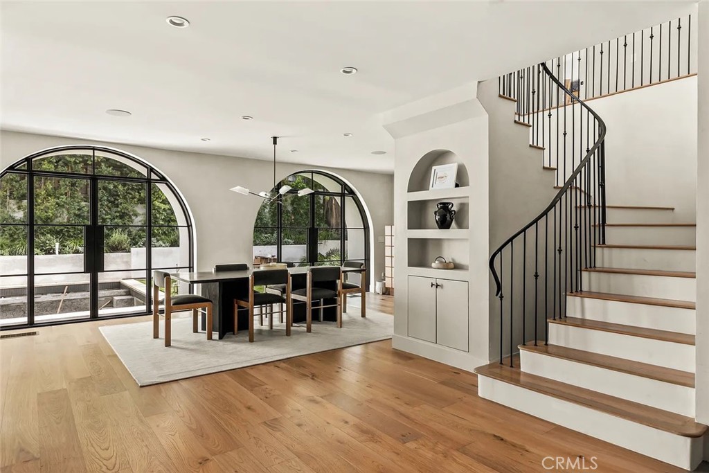 738 San Lorenzo Street Santa Monica, CA 90402 - Photo 15 of 50 a view of a livingroom with furniture staircase and floor to ceiling window