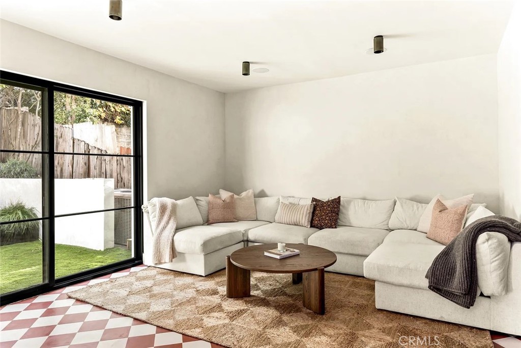 738 San Lorenzo Street Santa Monica, CA 90402 - Photo 17 of 50 a living room with furniture and a window