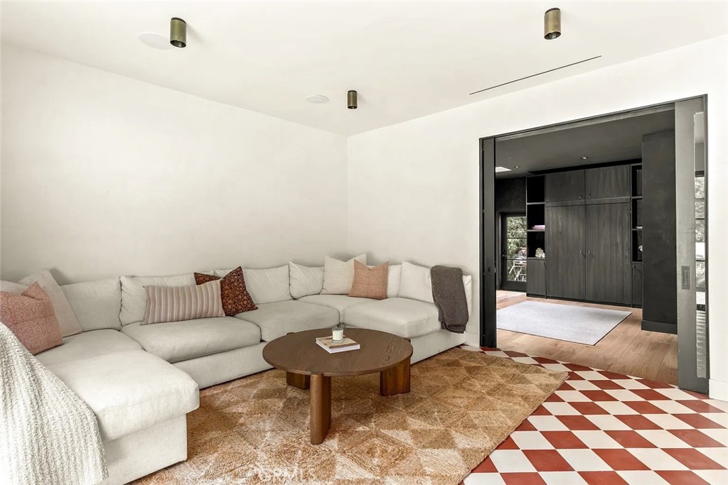 738 San Lorenzo Street Santa Monica, CA 90402 - Photo 18 of 50 a living room with furniture and a rug