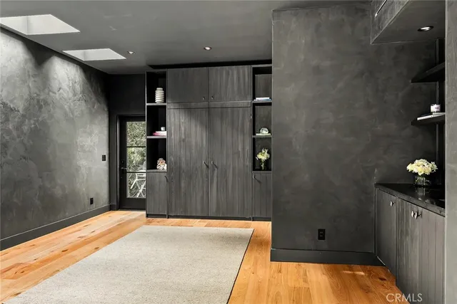 a bathroom with a toilet sink vanity and mirror