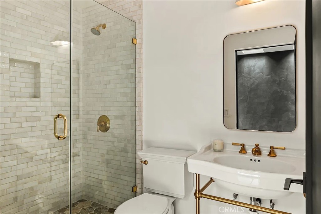 738 San Lorenzo Street Santa Monica, CA 90402 - Photo 23 of 50 a bathroom with a sink toilet and shower