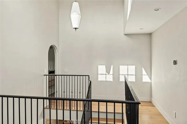 a spacious bedroom with a bed a couch and cabinet