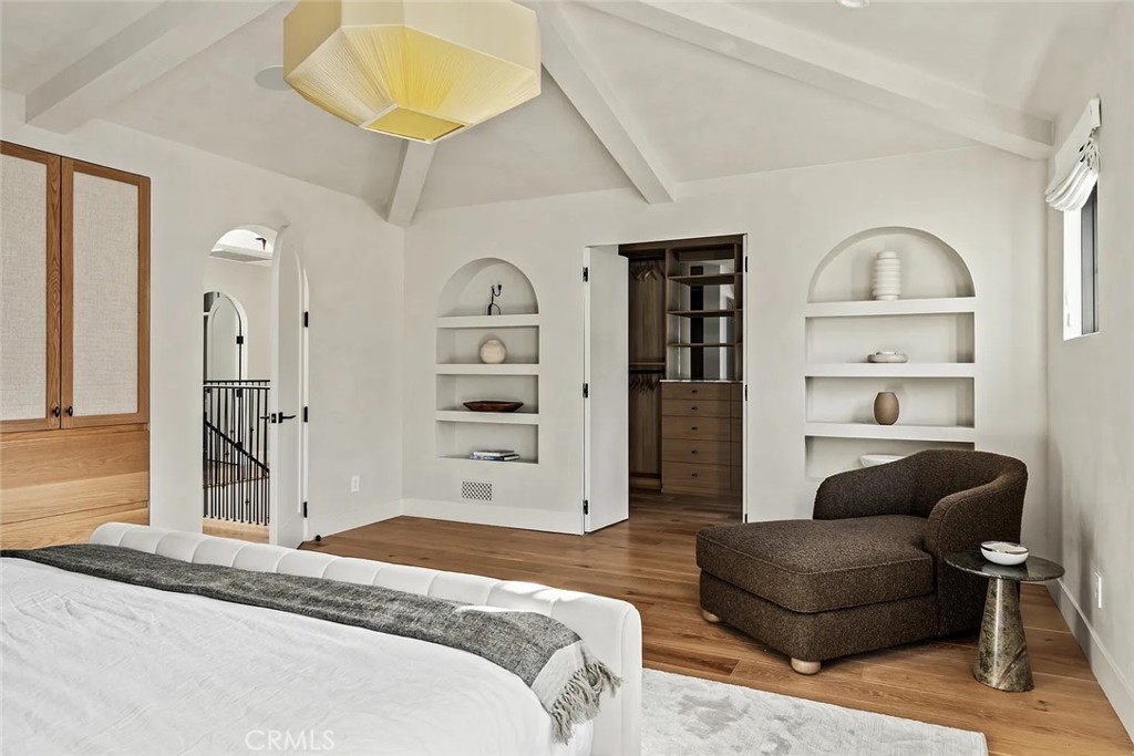 738 San Lorenzo Street Santa Monica, CA 90402 - Photo 28 of 50 a spacious bedroom with a bed a couch and cabinet