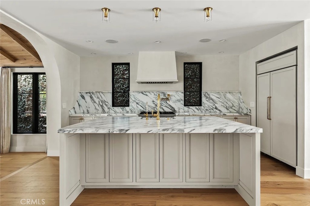 738 San Lorenzo Street Santa Monica, CA 90402 - Photo 3 of 50 a kitchen with granite countertop a sink and cabinets