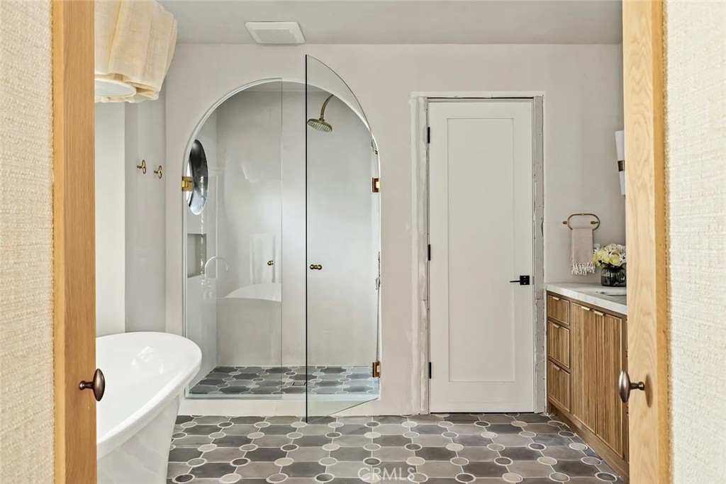 738 San Lorenzo Street Santa Monica, CA 90402 - Photo 31 of 50 a bathroom with a granite countertop sink and a mirror