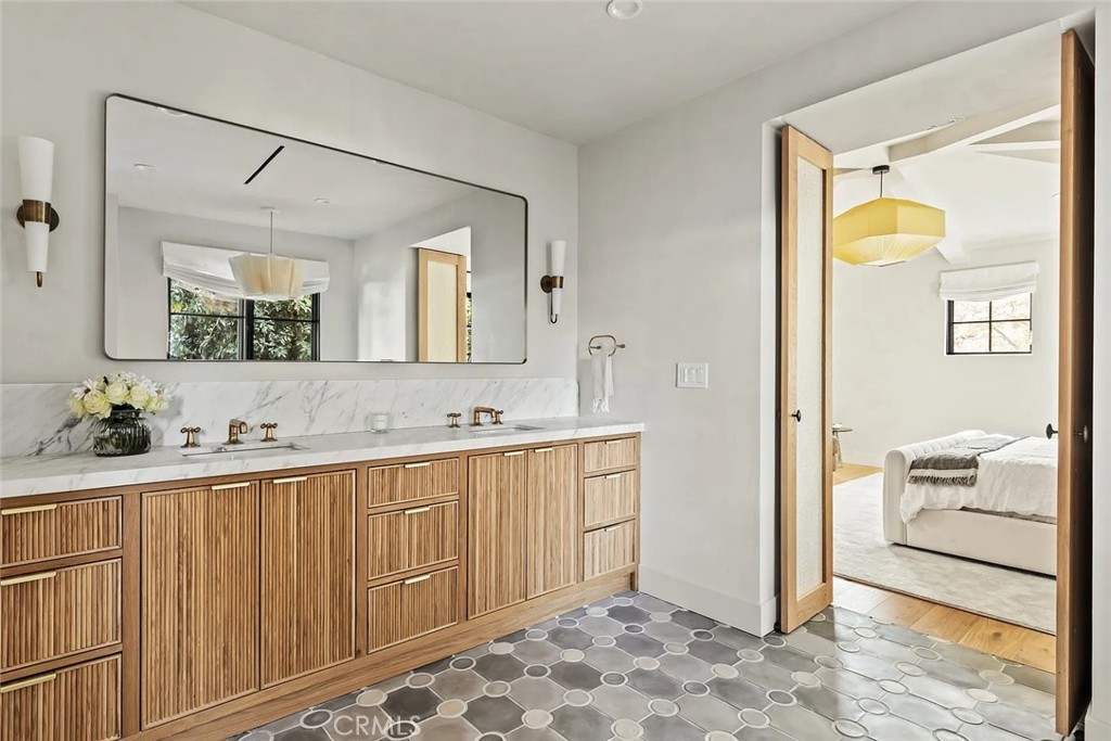 738 San Lorenzo Street Santa Monica, CA 90402 - Photo 34 of 50 a bathroom with a sink and a mirror