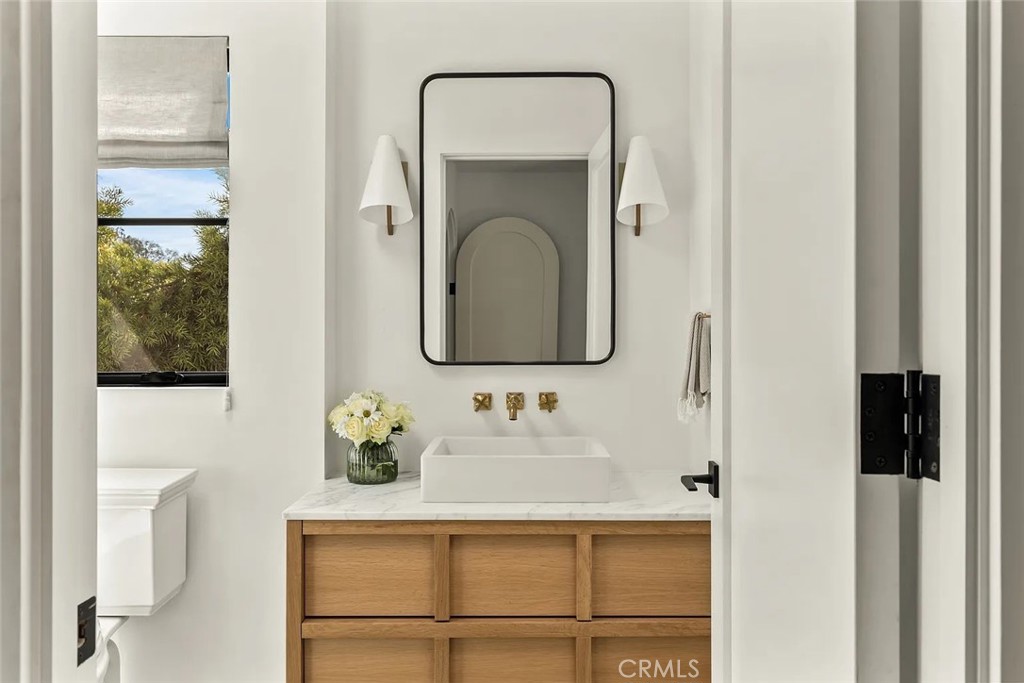 738 San Lorenzo Street Santa Monica, CA 90402 - Photo 37 of 50 a bathroom with a sink vanity and mirror