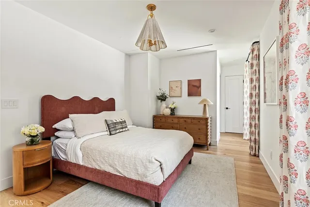 a view of a door and a chair in a bedroom