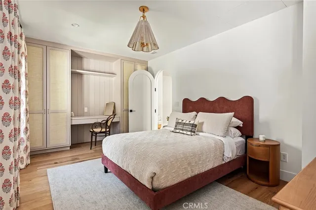 a bathroom with a sink mirror vanity and toilet