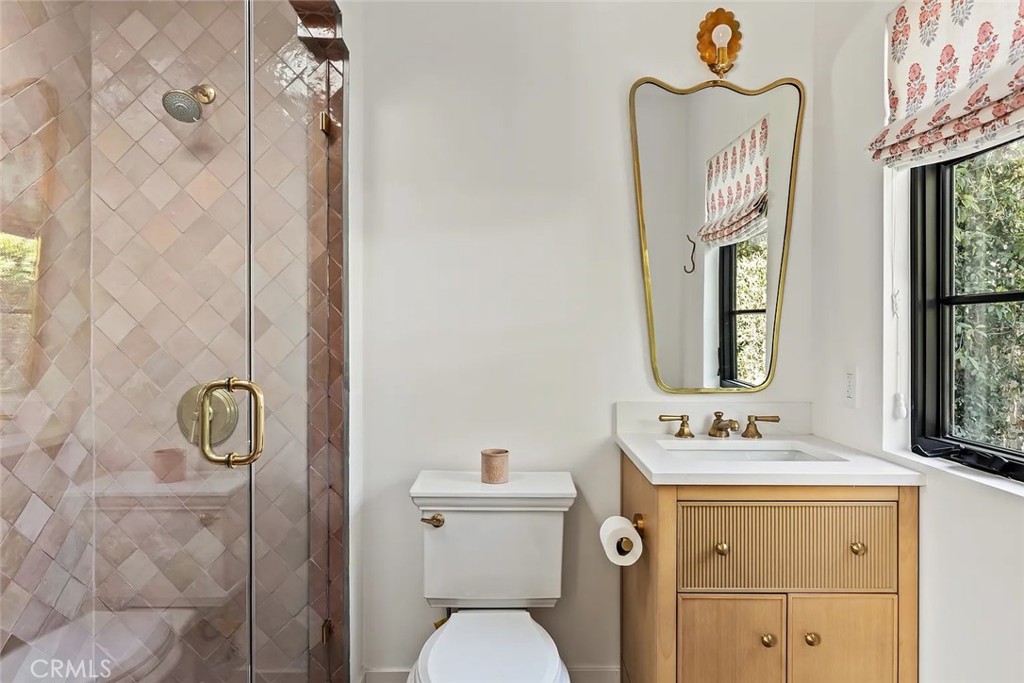 738 San Lorenzo Street Santa Monica, CA 90402 - Photo 42 of 50 a bathroom with a sink mirror vanity and toilet