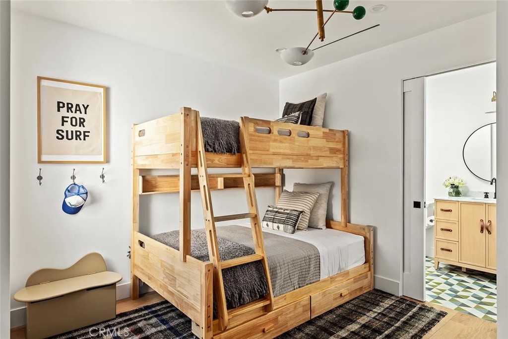 738 San Lorenzo Street Santa Monica, CA 90402 - Photo 43 of 50 a bedroom with a bed and wooden floor