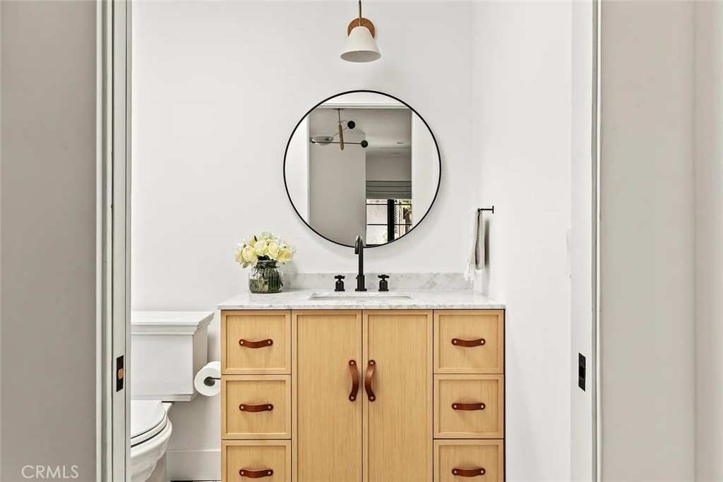 738 San Lorenzo Street Santa Monica, CA 90402 - Photo 46 of 50 a bathroom with a sink and a mirror