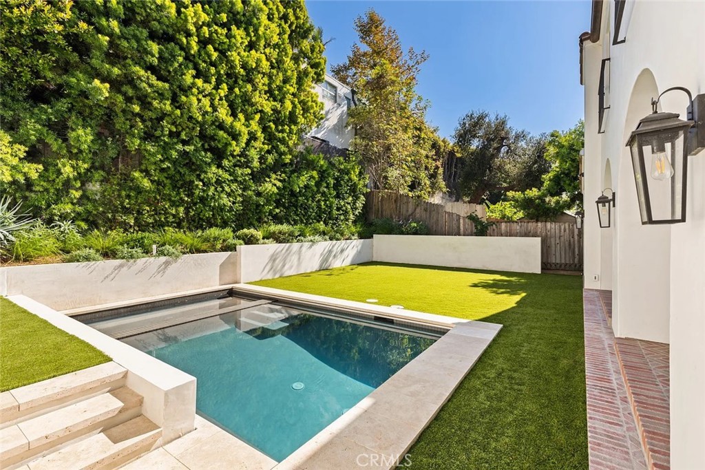 738 San Lorenzo Street Santa Monica, CA 90402 - Photo 7 of 50 a view of a swimming pool with a yard