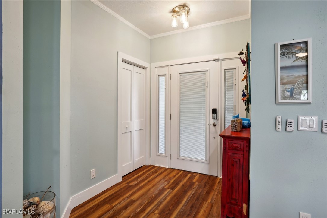 8335 Main Street Bokeelia, FL 33922 - Photo 14 of 47 a bedroom with a bed and a window