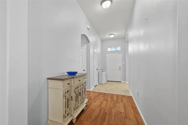 a view of a hallway view with wooden floor