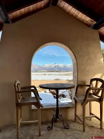 a view of a balcony with chairs