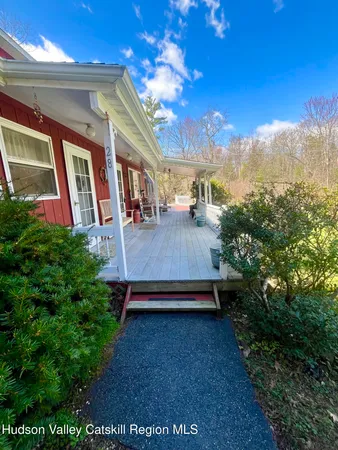 a living room with furniture a window and a fireplace