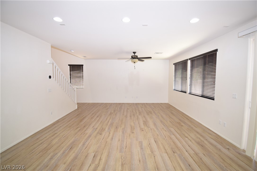 3622 Via Terracina Henderson, NV 89052 - Photo 6 of 22 Luminous flooring extends across this spacious, unfurnished area, complete with stair access and ample natural light.