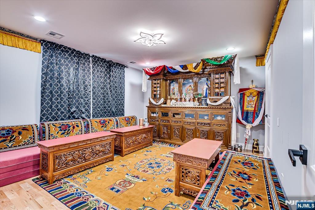 174 Manhattan Avenue Teaneck, NJ 07666 - Photo 21 of 45 a reading room with furniture and book shelf