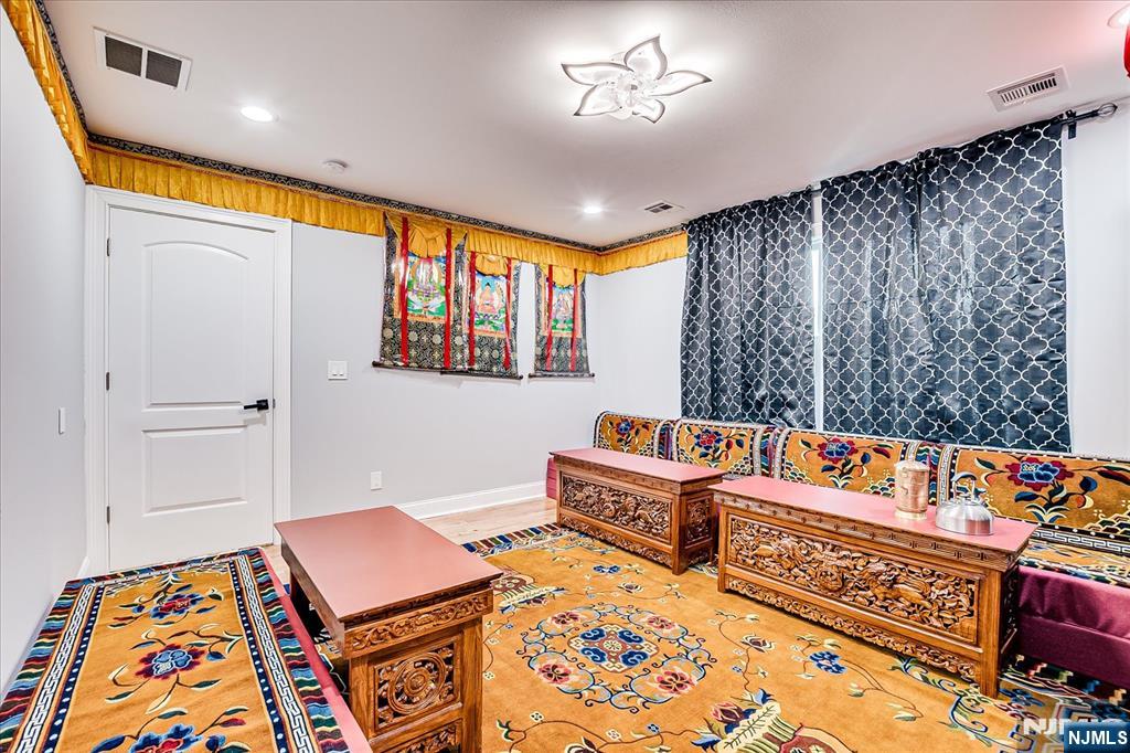 174 Manhattan Avenue Teaneck, NJ 07666 - Photo 22 of 45 a reading room with furniture and a rug