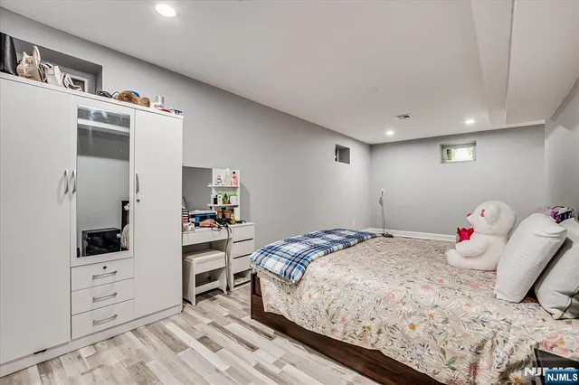 a bedroom with a bed and a closet