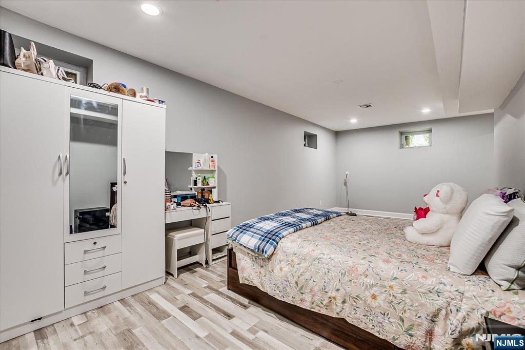 174 Manhattan Avenue Teaneck, NJ 07666 - Photo 28 of 45 a bedroom with a bed and a closet