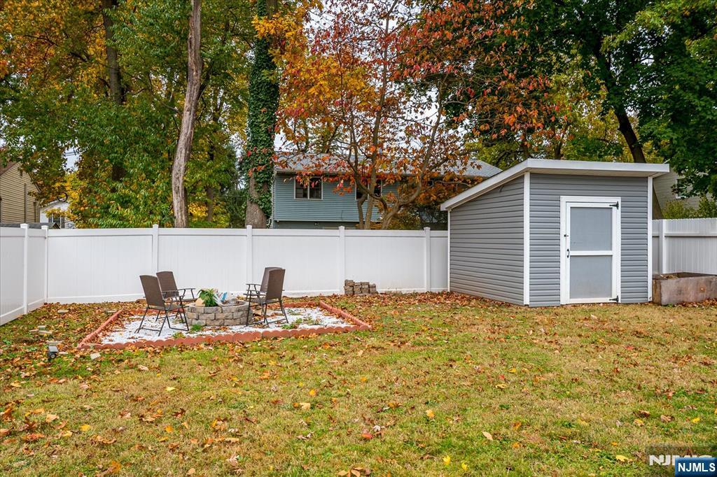 174 Manhattan Avenue Teaneck, NJ 07666 - Photo 34 of 45 a view of backyard of house with green space