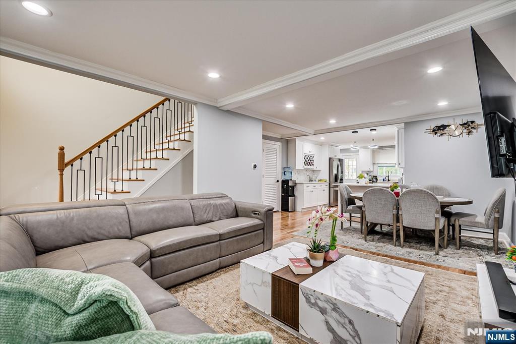 174 Manhattan Avenue Teaneck, NJ 07666 - Photo 6 of 45 a living room with furniture and wooden floor