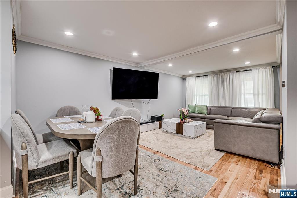 174 Manhattan Avenue Teaneck, NJ 07666 - Photo 8 of 45 a living room with furniture and a flat screen tv