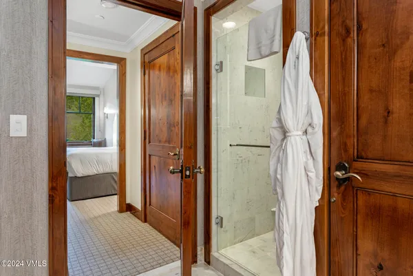 a view of closet and bathroom