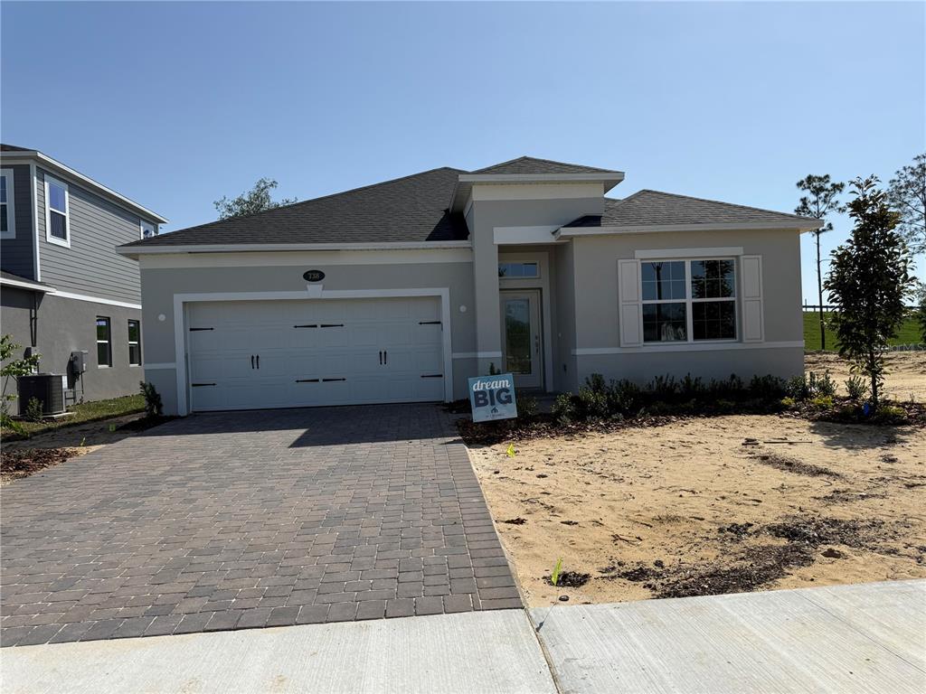 738 Pointe Emerson Boulevard Apopka, FL 32703 - Photo 1 of 22 a front view of a house with a yard